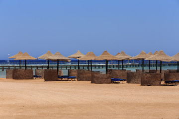 Beach sun parasol and blue sky, holliday in Egypt