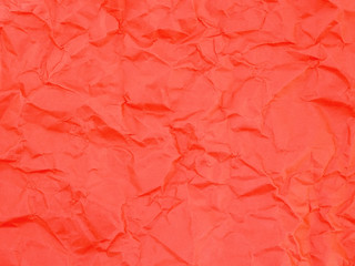 Fototapeta premium red wrinkled paper texture, vibrant crumpled parchment cardboard background