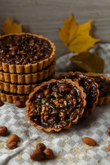 Autumn delicious cakes with nuts on plate.