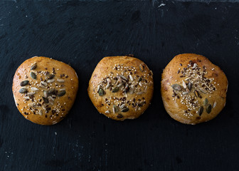 Burger buns on black background