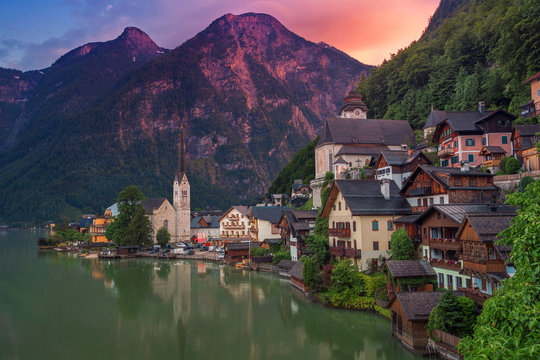 Hallstatt, Austria. Image of famous alpine village Halstatt during colourful summer sunset.
