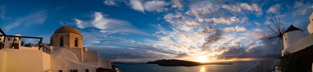 Oia village panorama, view of Santorini caldera at sunset , Santorini island, Greece
