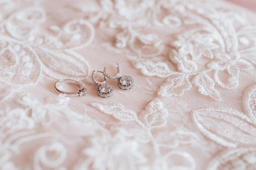 White Wedding dress on bed sheet close-up