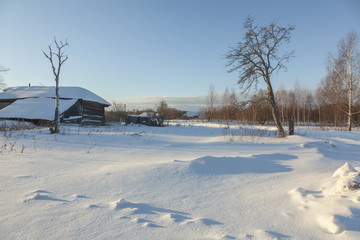 Fototapeta na wymiar snowbound House and clear winter day