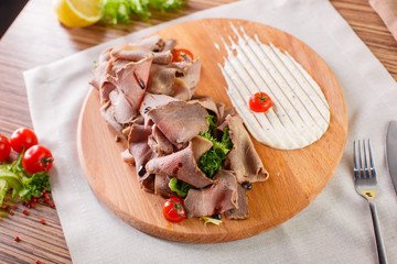 Fine meats with herbs and sauce