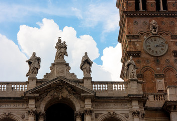 CLOCKTOWER AND STATUES OF CATHEDRAL IN ROME