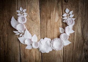 paper flowers on the wood background