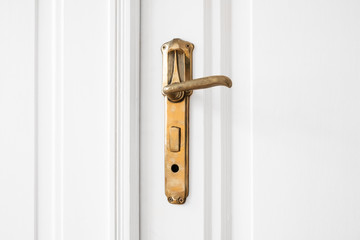 Obraz premium old door handle on white door