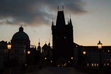 Sunrise in Prague, Charles Bridge, silhouette of towers.