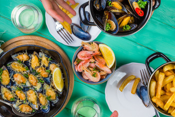 Family having summer lunch with seafood