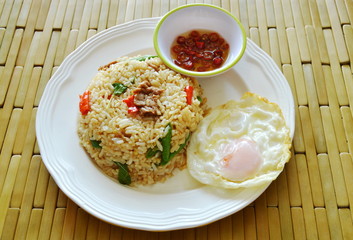 spicy fried rice pork and basil leaf topping fried egg with chili fish sauce