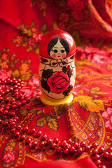 Matryoshka and red patterned headscarf