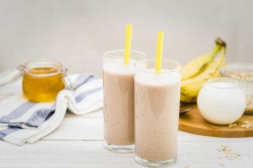 Milk shake with banana, oatmeal and honey, healthy breakfast