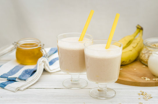 Milk shake with banana, oatmeal and honey, healthy breakfast