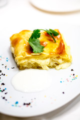 Cake of puff pastry with cheese.