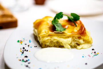 Cake of puff pastry with cheese.
