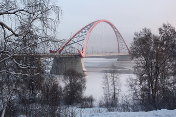 Fototapeta na wymiar The bridge across the Ob river in Novosibirsk in the winter.