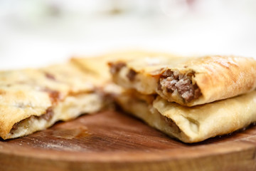 Traditional round pot pie or cake with meat.