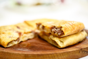 Traditional round pot pie or cake with meat.