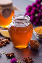 Jar of natural honey on table.