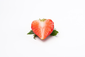 Red strawberry sliced look like heart on white background