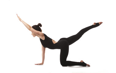 Practice yoga and gymnastics. Young girl trainer.