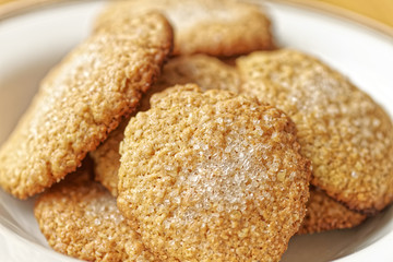Close-up view of homemade cookies. Macro photo of bakery oat cake. Oatmeal cookies on white plate.