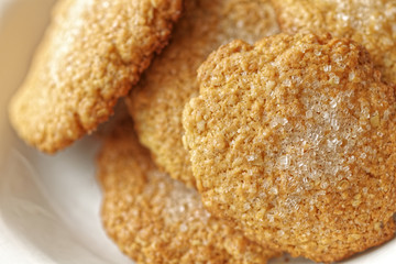Close-up view of homemade cookies. Macro photo of bakery oat cake. Oatmeal cookies on white plate.