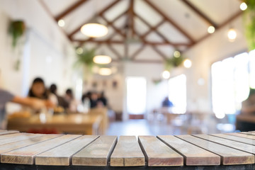 product display montage of Empty wooden table and blurred resturant or coffee shop background