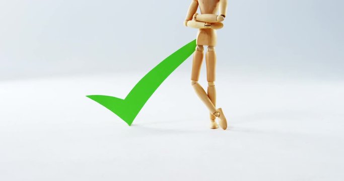 Figurine standing next to correct sign