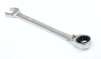 Metal spanner on white background