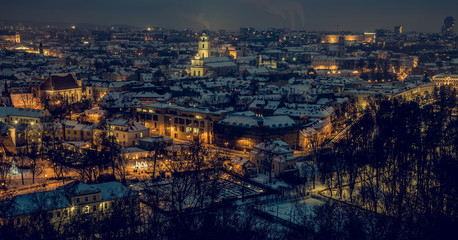 Night panorama of the Vilnius Old Town from the Hill of Three Crosses. Vilnius winter aerial panorama of Old town. Aerial panorama of the Vilnius Old Town at dusk time. Vilnius old town panorama.