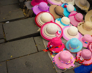 Pinky millinery and hats sold on the ground at Kota Tua Museum Area photo taken in Jakarta Indonesia