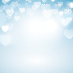 Romantic Bokeh background with heart lights. Blurred blue background.