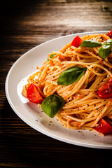 Pasta with meat, tomato sauce and vegetables 