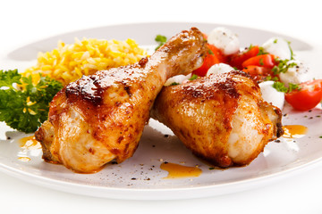 Roasted chicken drumsticks white rice and vegetables