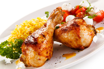 Roasted chicken drumsticks white rice and vegetables