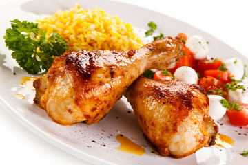 Roasted chicken drumsticks white rice and vegetables