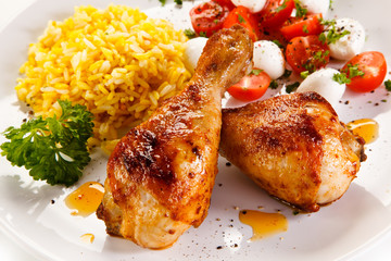 Roasted chicken drumsticks white rice and vegetables