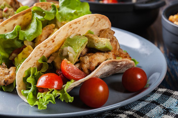 Authentic mexican tacos with chicken and salsa with avocado, tomatoes and chillies