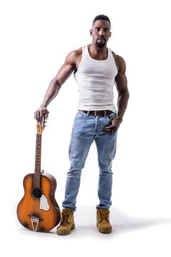 Muscular black man playing guitar, wearing jeans and white tank-top