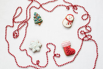 Gingerbread cookies hanging over white background