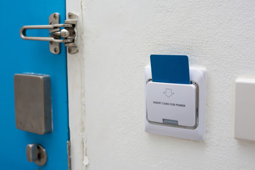 Blue key card in electronic lock with copy space.