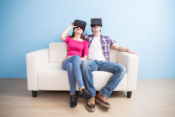 young couple watch vr game