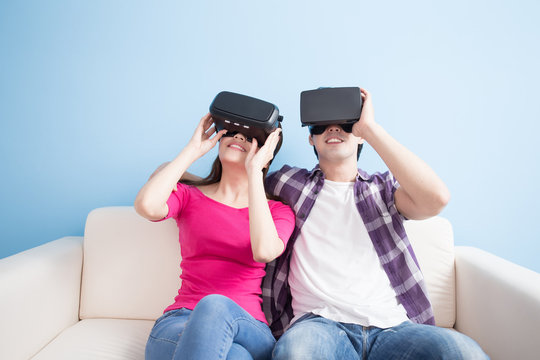 young couple watch vr game