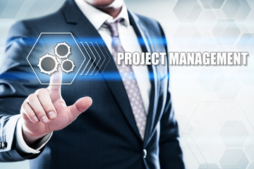 Business, technology, internet concept on hexagons and transparent honeycomb background. Businessman  pressing button on touch screen interface and select  project management