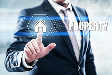 Business, technology, internet concept on hexagons and transparent honeycomb background. Businessman  pressing button on touch screen interface and select  property