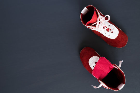 red leather shoes for sports on a dark background