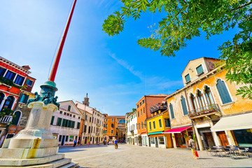 Fototapeta premium View of the colorful Venetian houses on a square in Venice