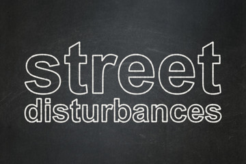 Politics concept: Street Disturbances on chalkboard background